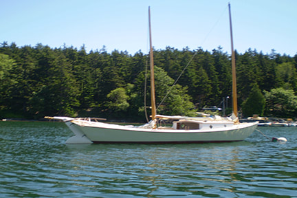 Reproduction 1892 wooden sailboat built by South Shore Boatworks on mooring