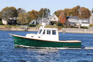 Lobster boat underway in ocean that was restored and refit by South Shore Boatworks