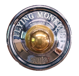 chromed bronze wheel hub for sailing yacht or ship with bronze wheel nut engraved with flying monkeys and built by south shore boatworks