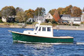 wooden downeast style boat refit and restored by south shore boatworks underway on the ocean