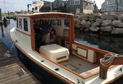 wooden downeast style boat at dock that was refit and restored by south shore boatworks