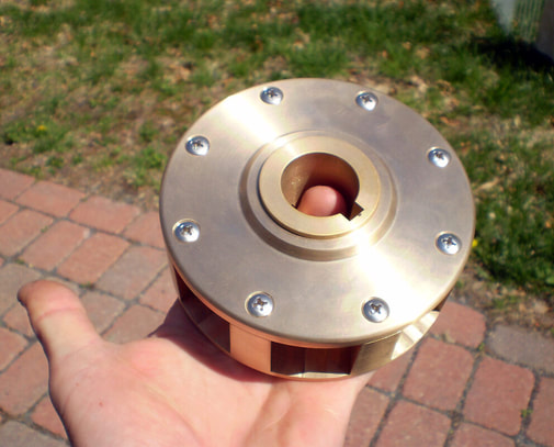 Bronze steering wheel hub for yacht or ship made from wooden foundry patterns built by South Shore Boatworks