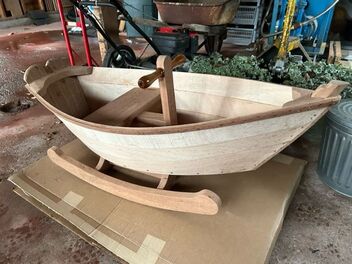 A plymouth rock'r wooden rocking boat built at a Bob Fuller and South Shore Boatworks class