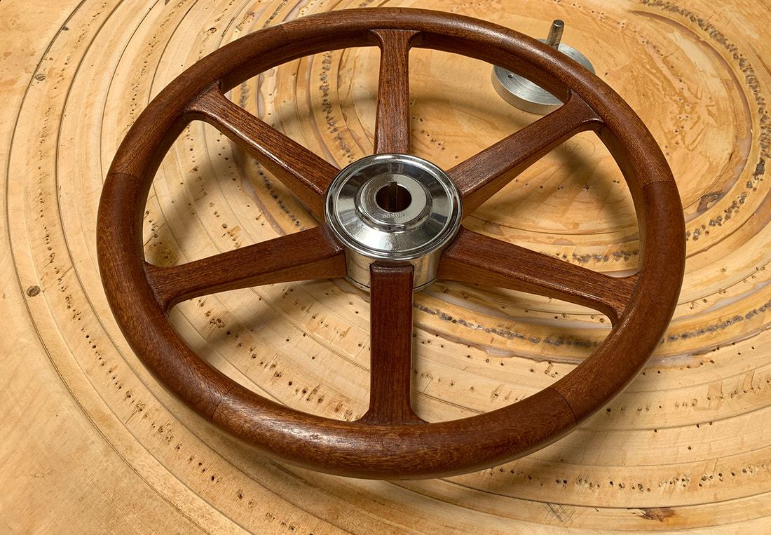 south shore boatworks wooden powerboat steering wheel with chromed bronze hub varnished with fingergrips