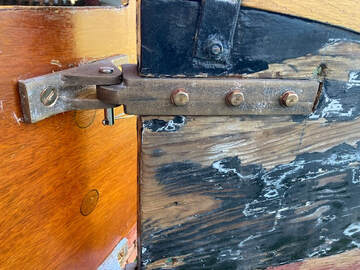 Upper bronze rudder hardware, pintle and gudgeon, for a catboat cast from patterns built by South Shore Boatworks